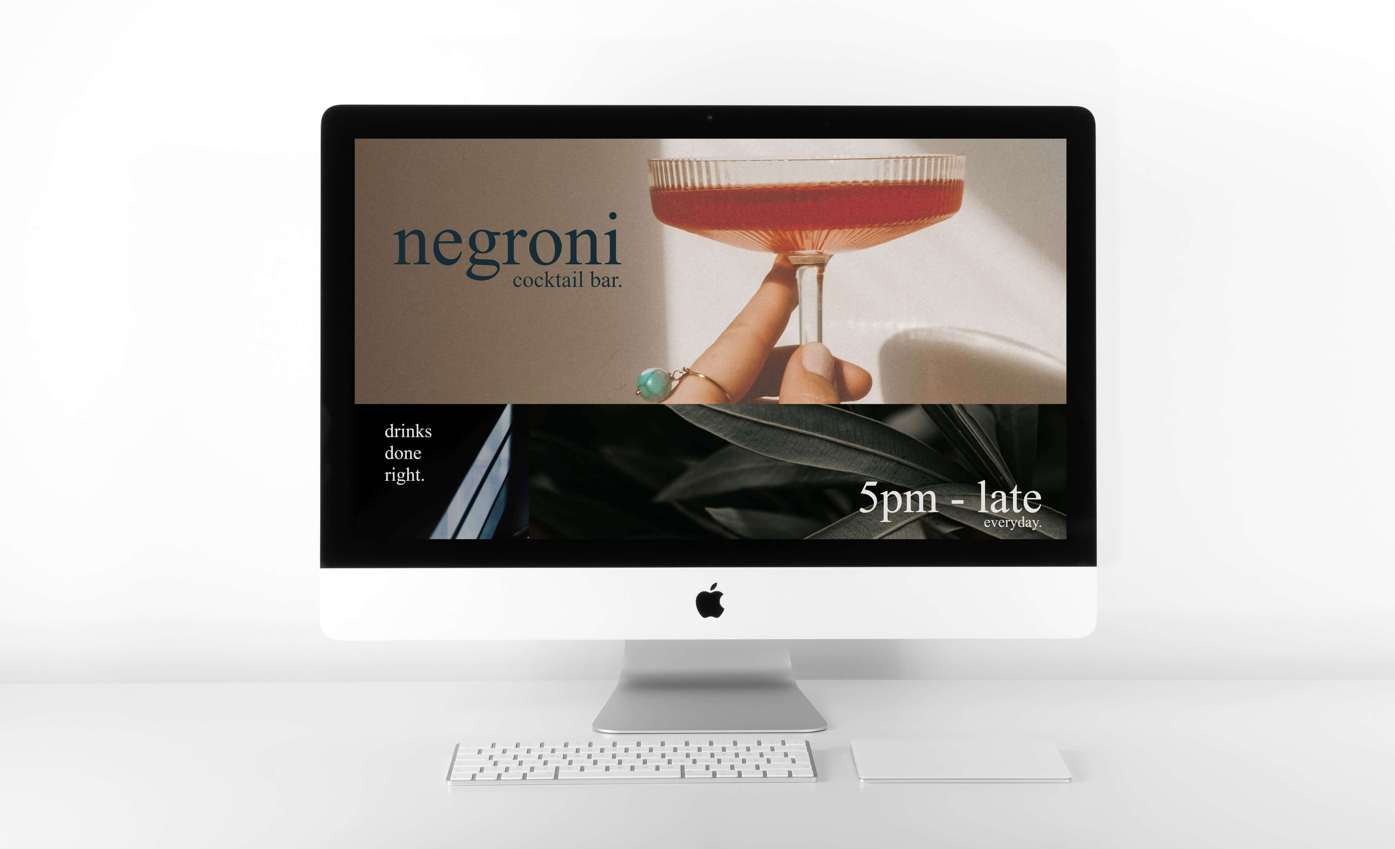 Imac computer displaying Negroni Cocktail bar website. Photo orginally by Quaritsch Photography