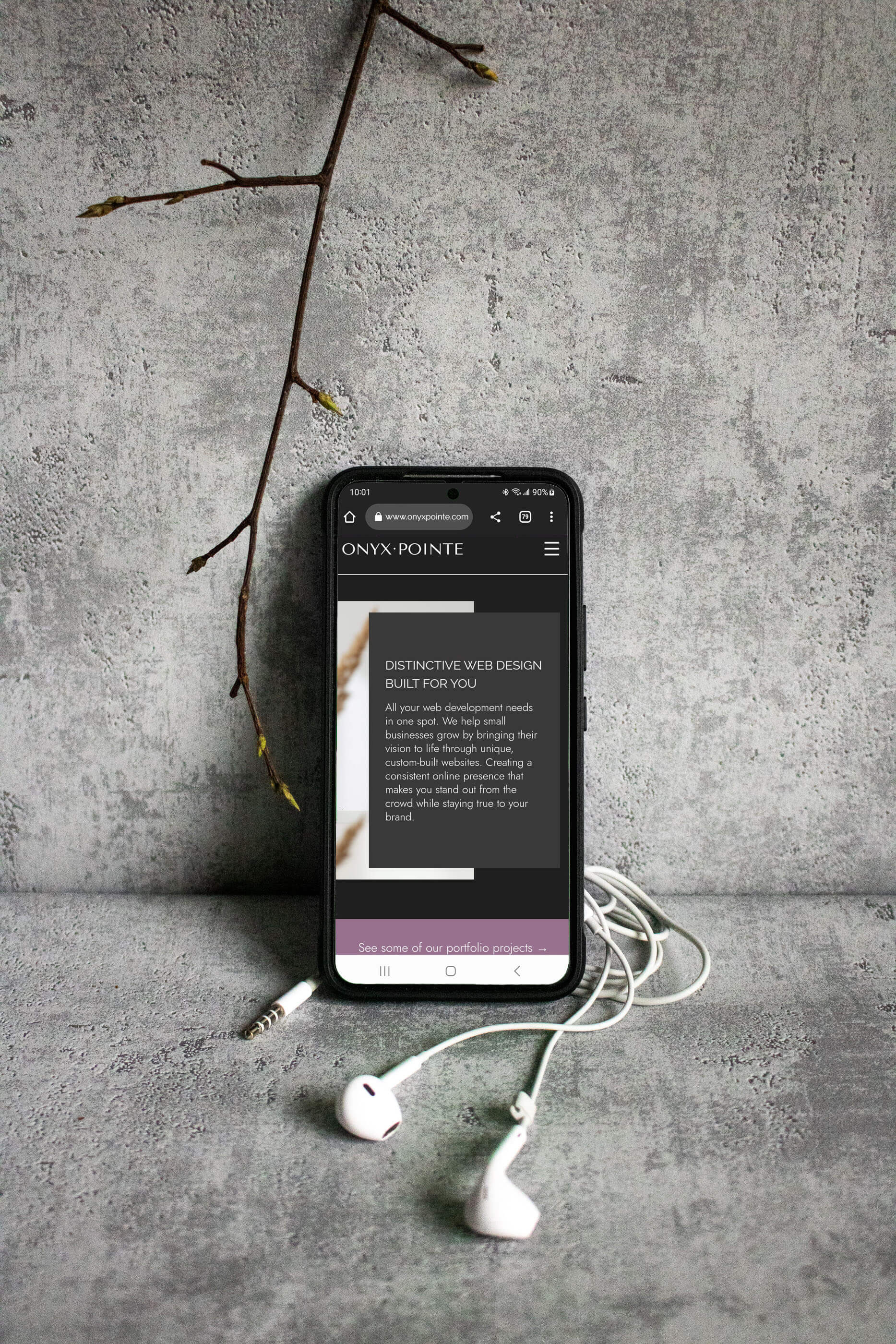 Phone displaying Onyx Pointe website.